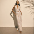 model wearing white gold lurex knit halter top and maxi skirt kukhareva london