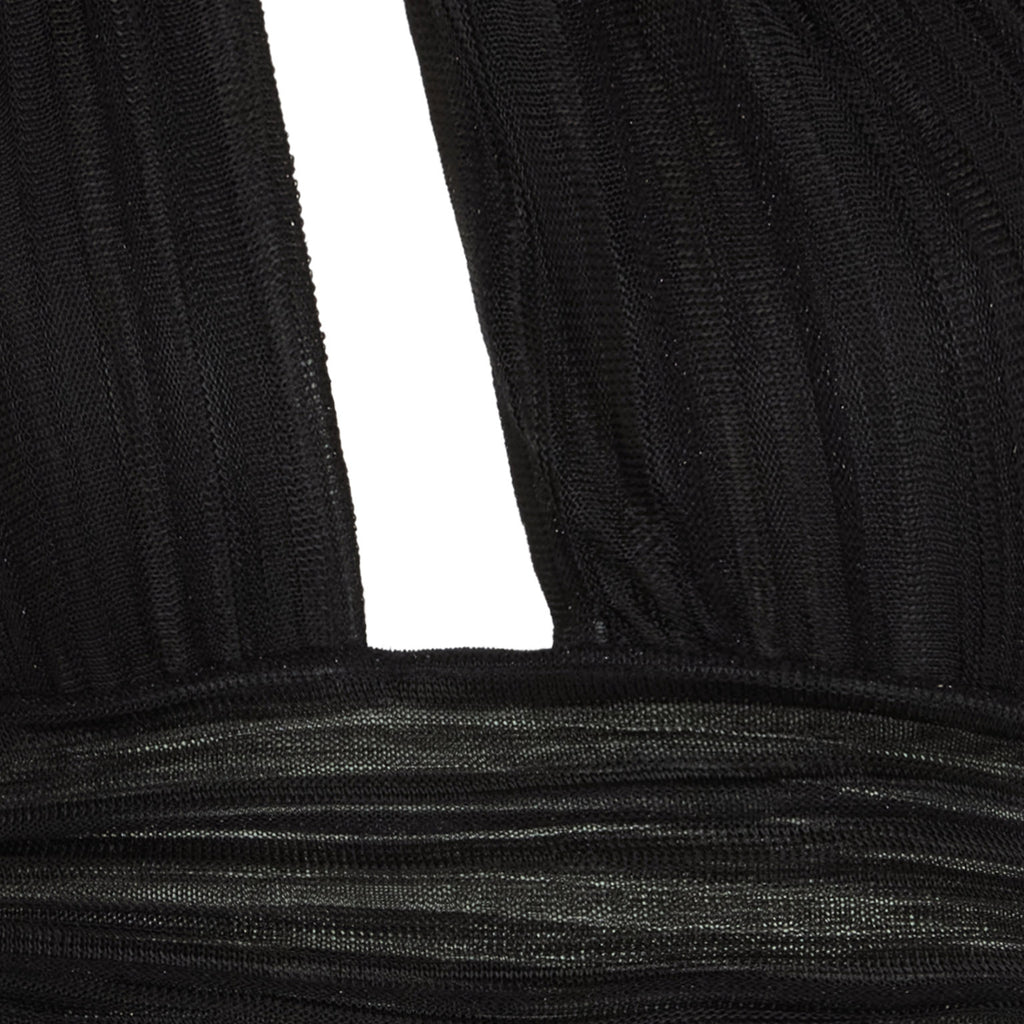 Close-up of black ribbed fabric with a white background