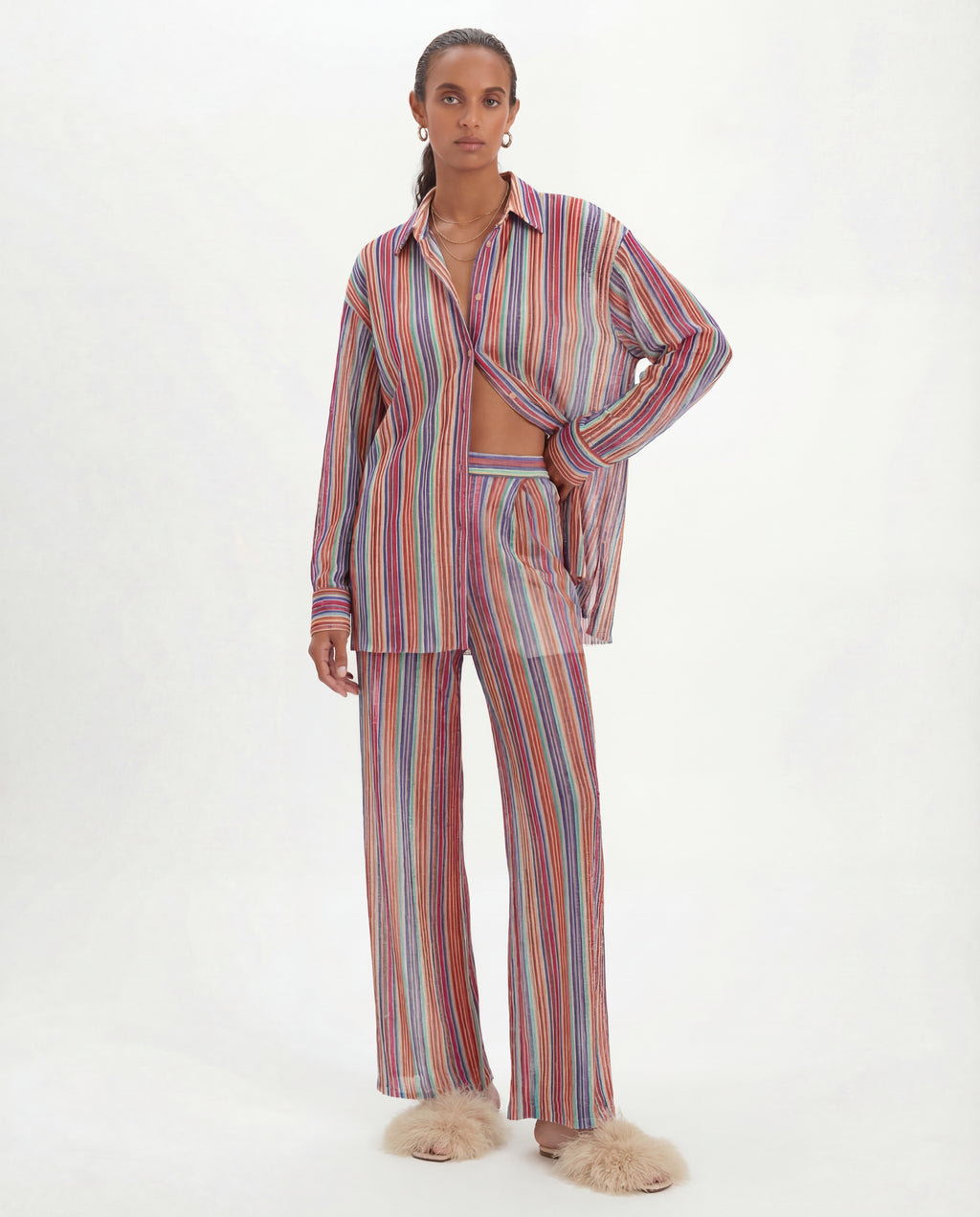 model wearing a multicoloured lurex striped pyjama set on a white background iris shirt by kukhareva london