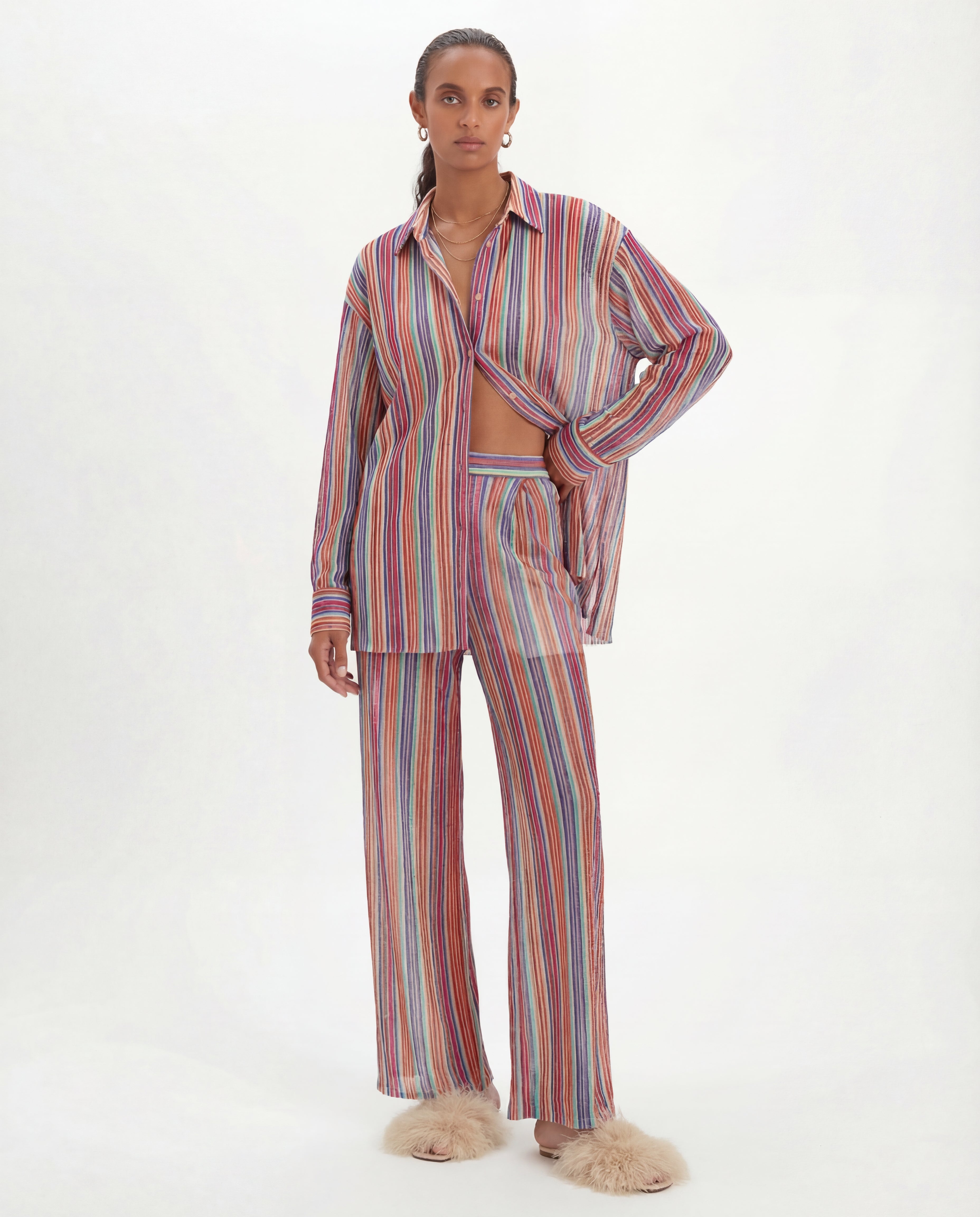 model wearing a multicoloured lurex striped pyjama set on a white background iris shirt by kukhareva london