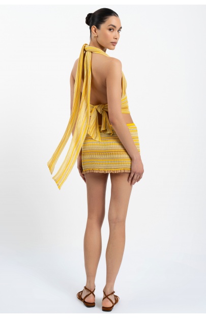 model back view of the Bella halterneck top in sunshine butter yellow